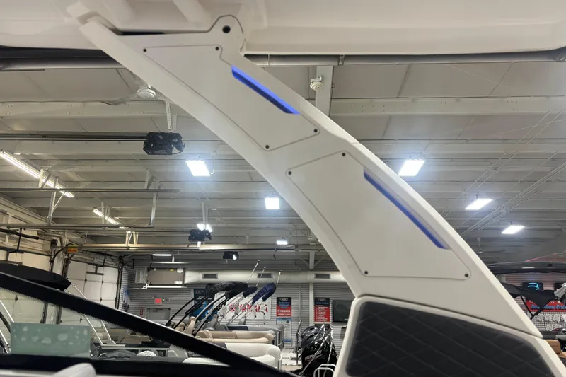 Slide: The Image of Interior view of 2026 Chaparral SSX 30 boat with modern design and blue LED lighting. - 26