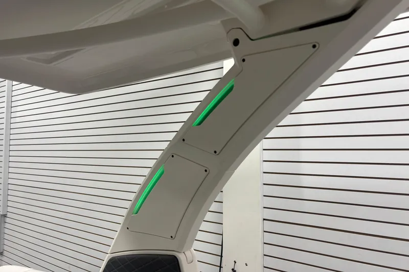 Slide: The Image of 2026 Chaparral SSX 30 boat detail with sleek design and green LED accents. - 32