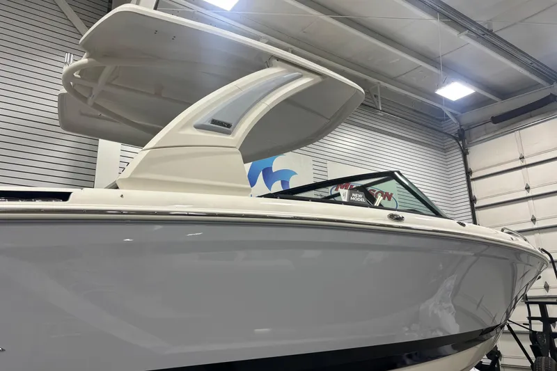 Slide: The Image of 2026 Chaparral SSX 30 boat in showroom, showcasing sleek design and modern features. - 7