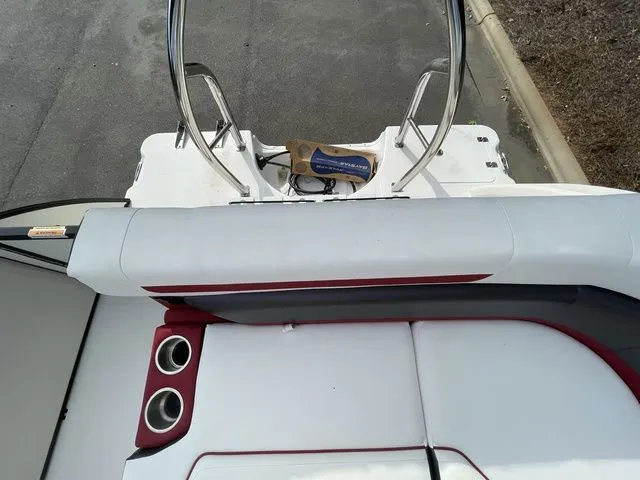 Slide: The Image of 2023 Hurricane FunDeck 1960 REF OB boat interior with seating and cup holders. - 10