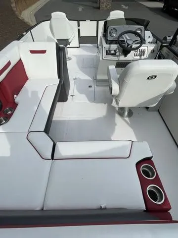 Slide: The Image of 2023 Hurricane FunDeck 1960 REF OB boat interior with white and red seating, steering console. - 3