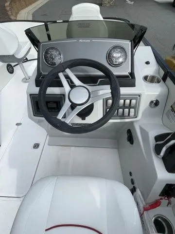 Slide: The Image of 2023 Hurricane FunDeck 1960 REF OB boat dashboard with steering wheel and controls. - 5