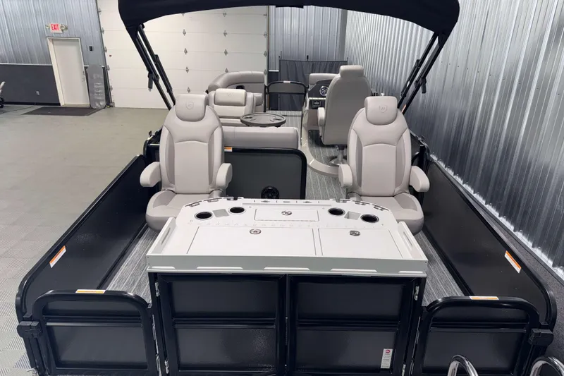 Slide: The Image of 2026 Premier 230 Sunsation Angler Tritoon interior with seating and fishing setup. - 10