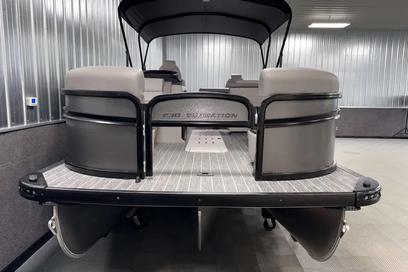 Slide: The Image of 2026 Premier 230 Sunsation Angler 2pt Tritoon in showroom, rear view. - 2