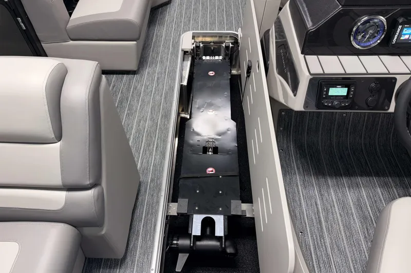 Slide: The Image of Interior view of 2026 Premier 230 Sunsation Angler Tritoon with open storage compartment. - 21