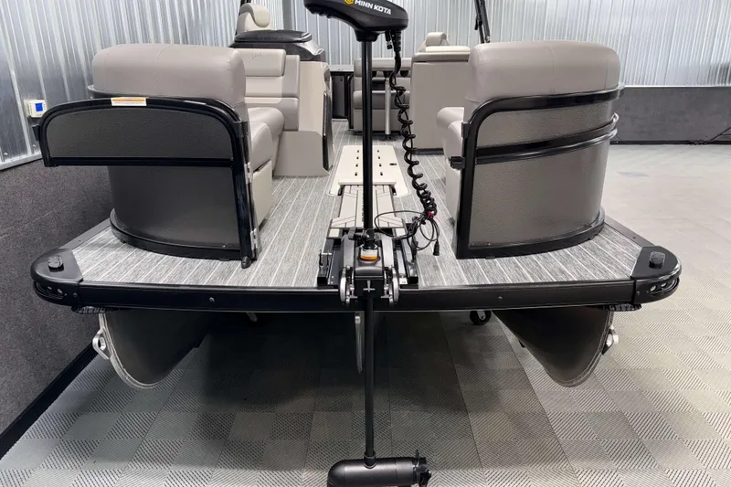Slide: The Image of 2026 Premier 230 Sunsation Angler 2pt Tritoon, interior view with seating and motor. - 23