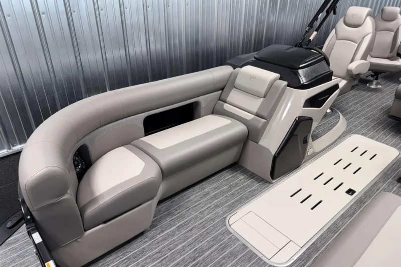 Slide: The Image of Luxurious interior of 2026 Premier 230 Sunsation Angler 2pt Tritoon with plush seating. - 27