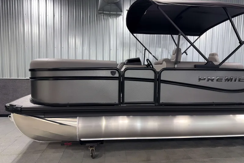 Slide: The Image of 2026 Premier 230 Sunsation Angler 2pt Tritoon in showroom, side view with canopy. - 4