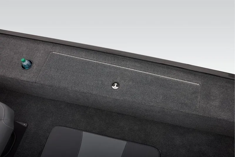 Slide: The Image of 2026 Tracker Panfish 17 boat interior with storage compartment and cup holder. - 10