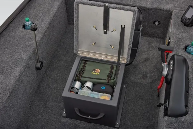 Slide: The Image of 2026 Tracker Panfish 17 boat storage compartment with fishing gear and accessories. - 16