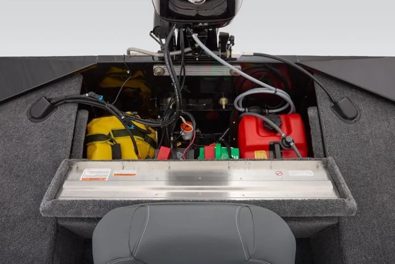 Slide: The Image of 2026 Tracker Panfish 17 boat interior showing engine compartment and storage. - 18