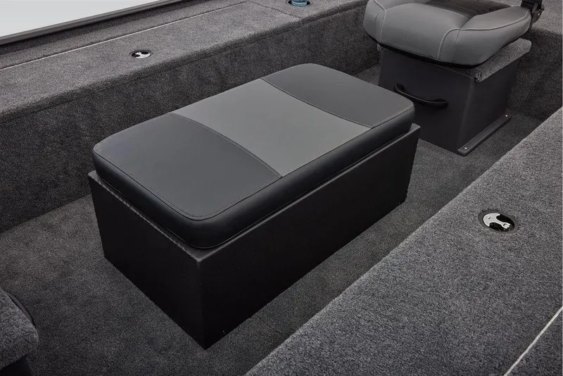 Slide: The Image of 2026 Tracker Panfish 17 boat interior with cushioned seating and carpeted flooring. - 7