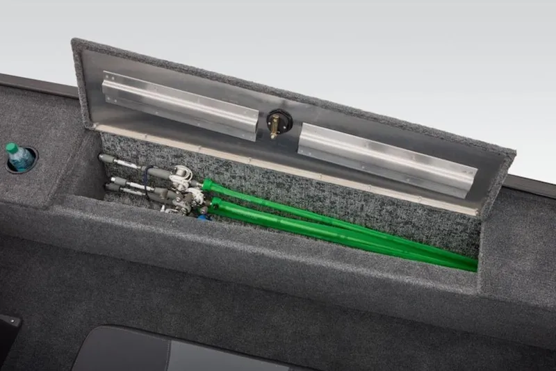 Slide: The Image of 2026 Tracker Panfish 17 boat storage compartment with fishing rods and cup holder. - 9