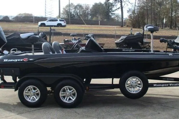 Slide: The Image of 2026 Ranger Z185 boat on trailer, parked outdoors, side view. - 11