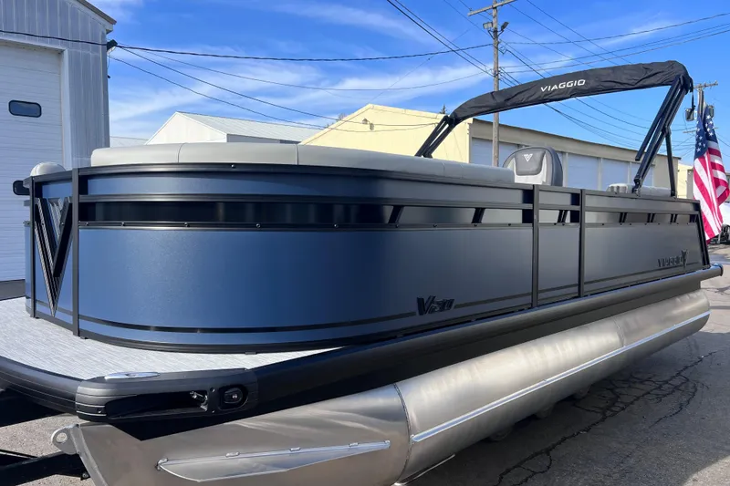 Slide: The Image of 2026 Viaggio V 20U pontoon boat with sleek design, docked outdoors. - 10