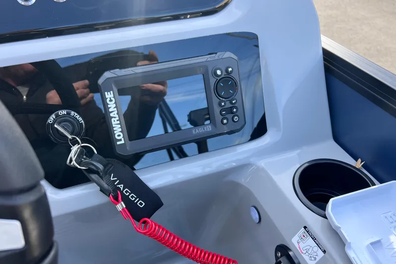Slide: The Image of Control panel of 2026 Viaggio V 20U boat with Lowrance display and key ignition. - 17