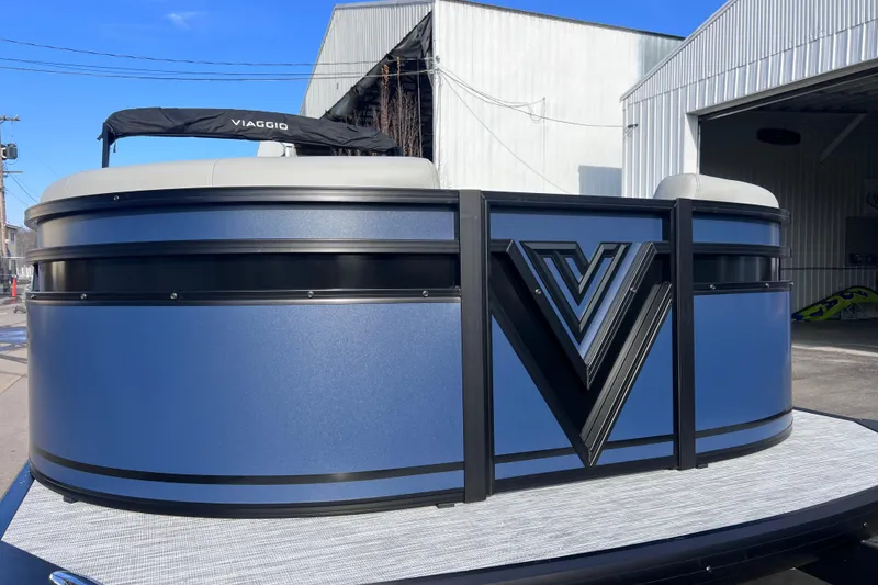 Slide: The Image of 2026 Viaggio V 20U pontoon boat with sleek blue design and prominent logo. - 6