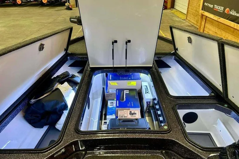 Slide: The Image of 2026 Ranger Z521R Cup-Equipped boat storage compartments with gear and equipment. - 12