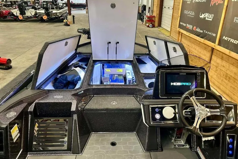 Slide: The Image of 2026 Ranger Z521R Cup-Equipped boat interior with advanced navigation system and storage compartments. - 14
