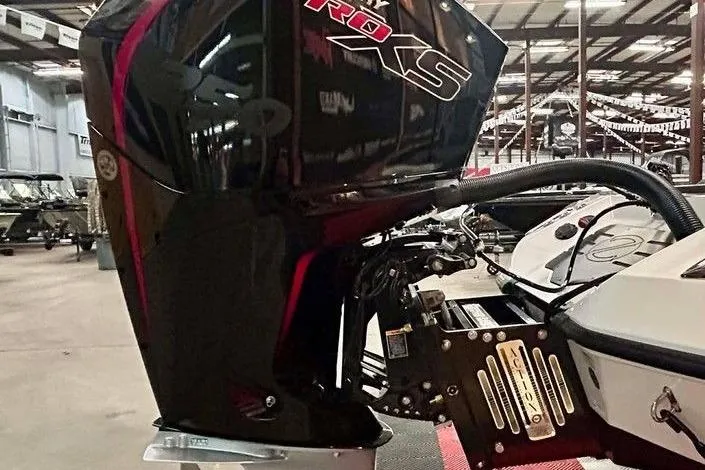 Slide: The Image of 2026 Ranger Z521R Cup-Equipped boat engine in a showroom setting. - 5