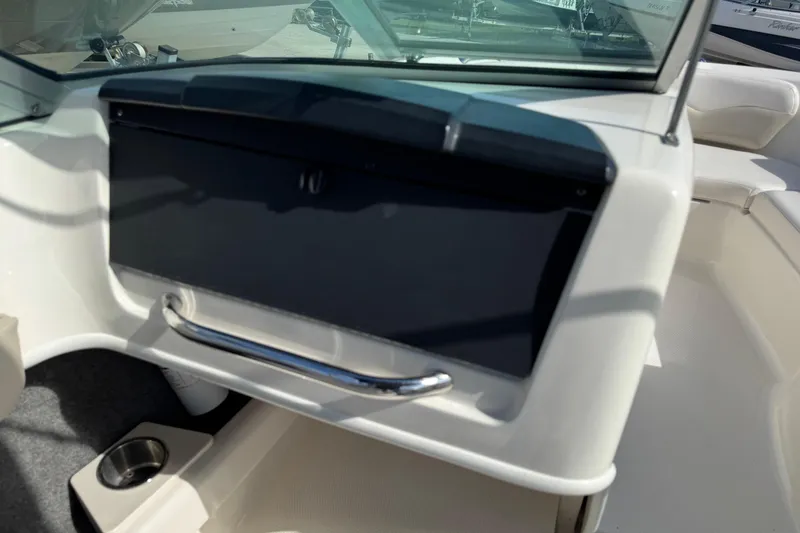 Slide: The Image of 2011 Chaparral 186 SSi boat interior with dashboard and seating area. - 10