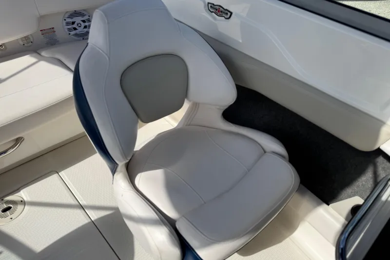 Slide: The Image of 2011 Chaparral 186 SSi boat interior with white and gray seating. - 11