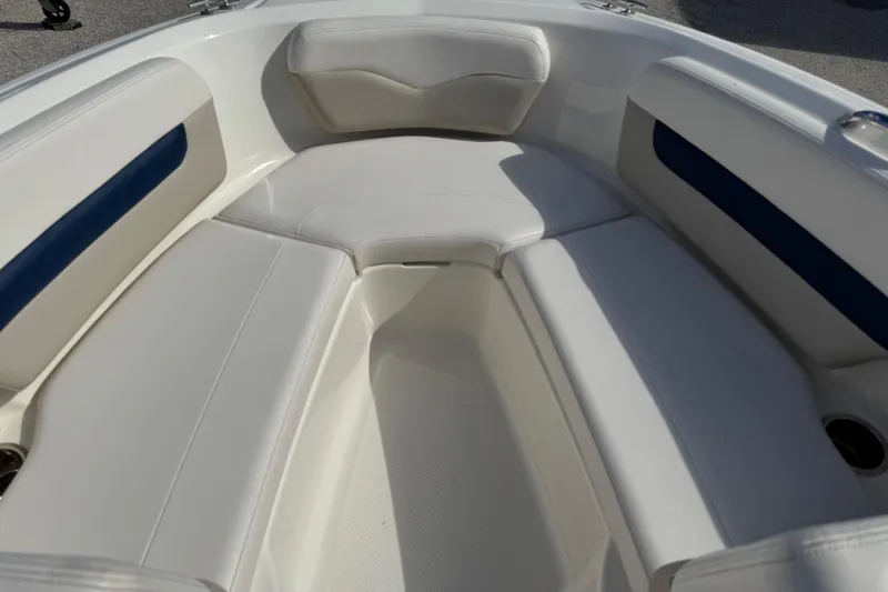 Slide: The Image of 2011 Chaparral 186 SSi boat interior with white and blue cushioned seating. - 12