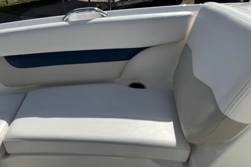 Slide: The Image of 2011 Chaparral 186 SSi boat interior with white and blue seating. - 14