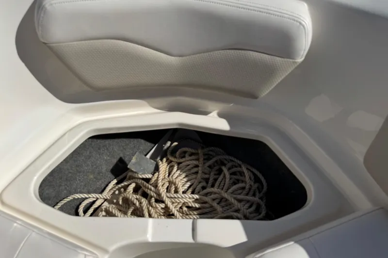 Slide: The Image of Storage compartment with rope in 2011 Chaparral 186 SSi boat. - 16