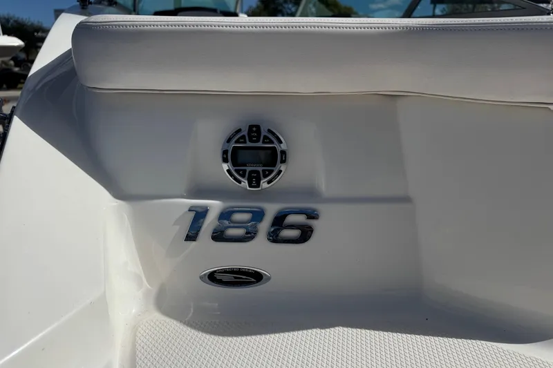 Slide: The Image of 2011 Chaparral 186 SSi boat interior with Kenwood audio system and model emblem. - 22