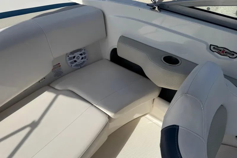 Slide: The Image of 2011 Chaparral 186 SSi boat interior with white seating and speaker. - 5