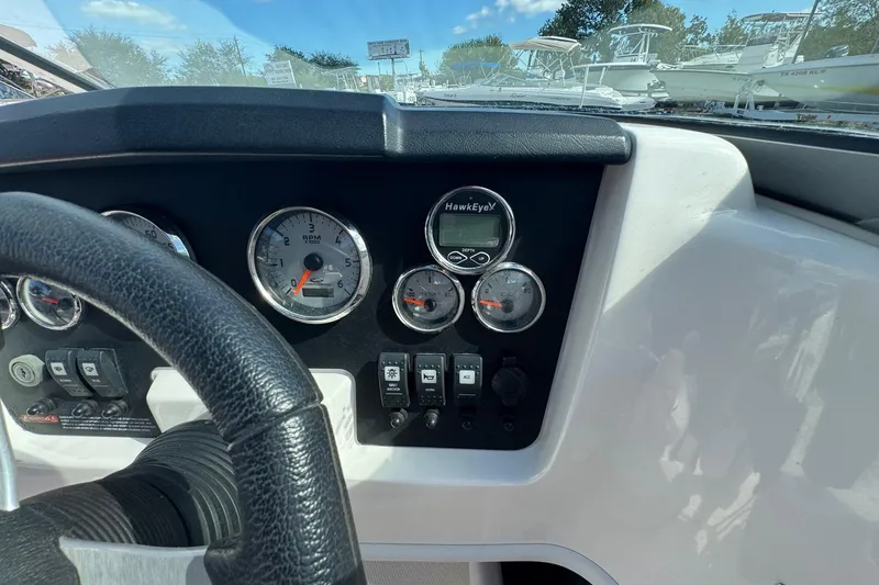 Slide: The Image of Dashboard of a 2011 Chaparral 186 SSi boat with gauges and controls. - 9