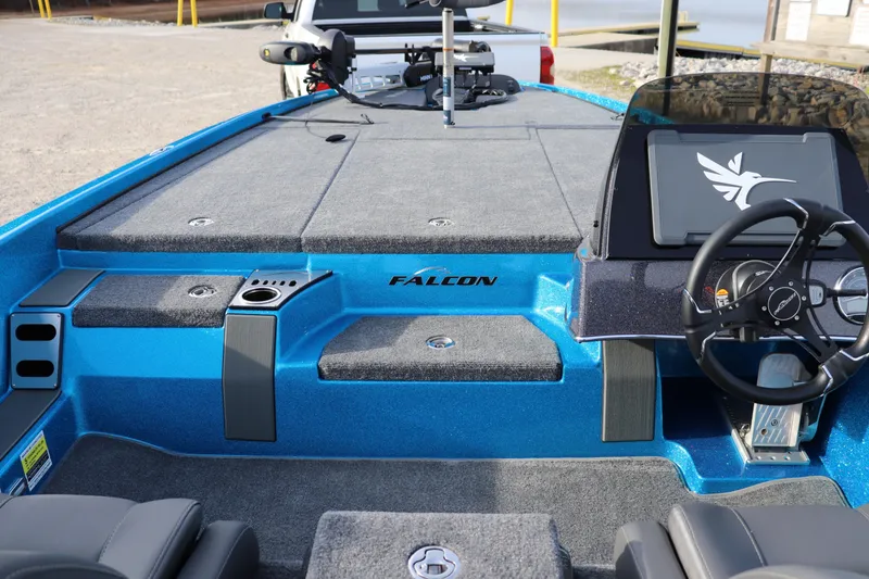 Slide: The Image of 2026 Falcon Boats F205 interior with steering wheel and deck, showcasing modern design. - 18