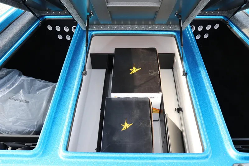 Slide: The Image of Open storage compartment of 2026 Falcon Boats F205, featuring organized interior space. - 5
