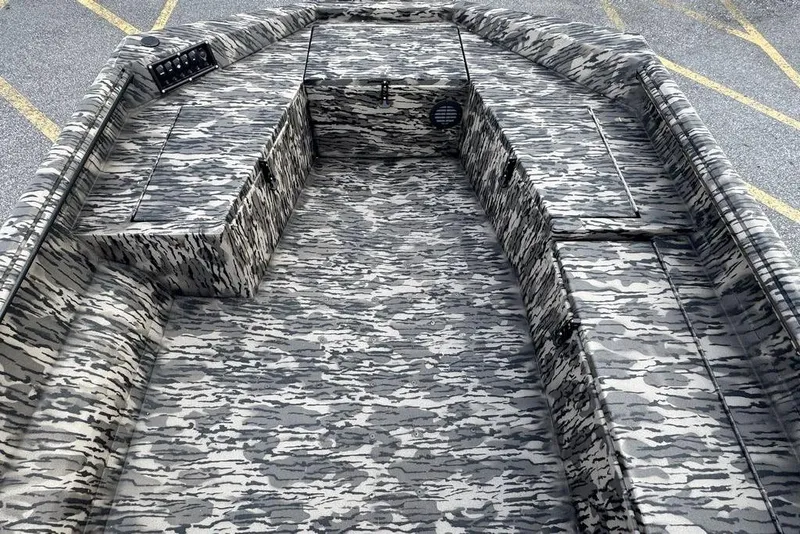 Slide: The Image of 2026 Havoc 1756 boat interior with camouflage pattern and storage compartments. - 13