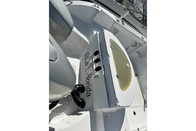 Slide: The Image of 2005 Sea Fox 287 Walkaround boat interior with fishing rod holders, located in Stuart, Florida. - 10
