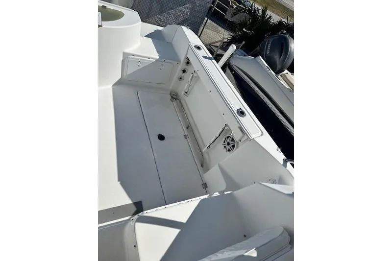 Slide: The Image of 2005 Sea Fox 287 Walkaround boat interior, featuring spacious deck and storage compartments. - 13