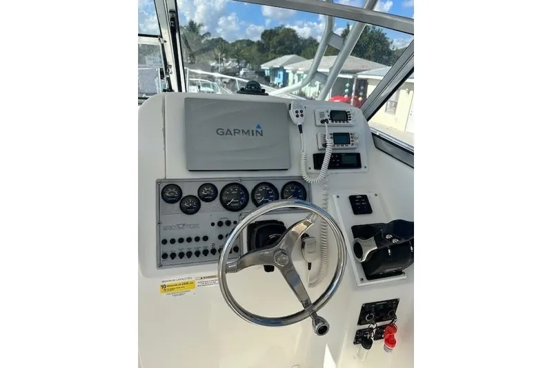 Slide: The Image of 2005 Sea Fox 287 Walkaround helm with Garmin navigation and control panel. - 15