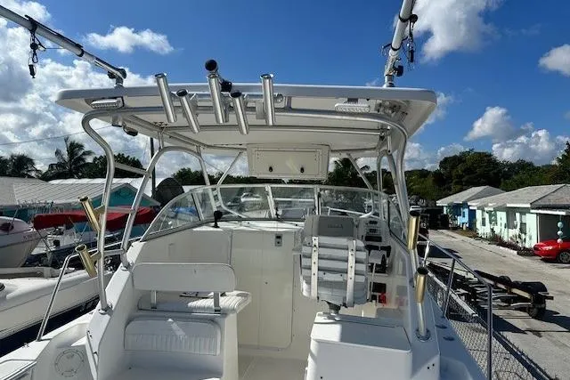 Slide: The Image of 2005 Sea Fox 287 Walkaround boat with spacious cockpit and fishing rod holders. - 20