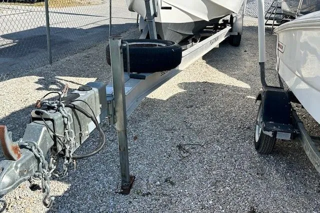 Slide: The Image of Trailer for 2005 Sea Fox 287 Walkaround boat parked on gravel. - 21