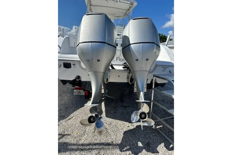 Slide: The Image of 2005 Sea Fox 287 Walkaround with dual outboard motors, rear view. - 8