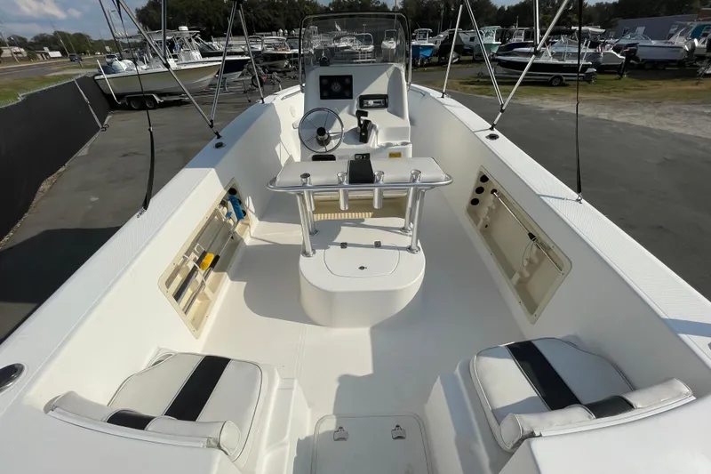Slide: The Image of 2004 Fishmaster Travis Edition 220 boat interior with steering console and seating. - 12