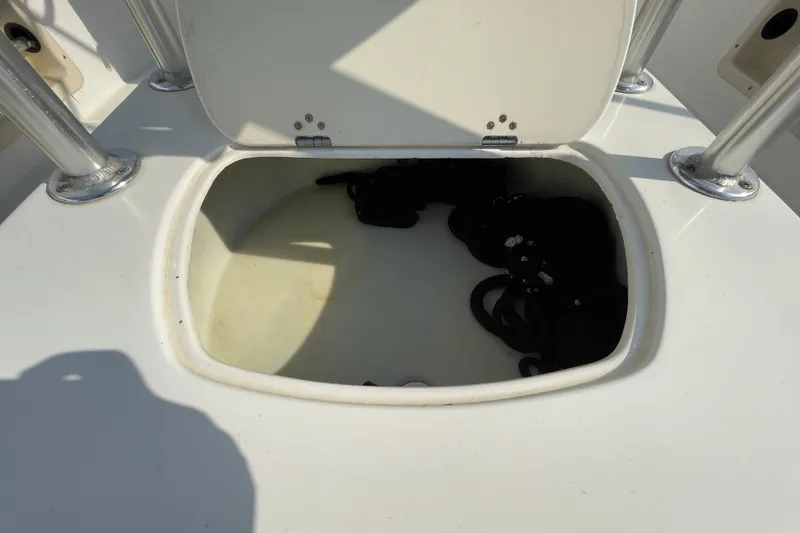 Slide: The Image of Open storage compartment on 2004 Fishmaster Travis Edition 220 boat. - 16