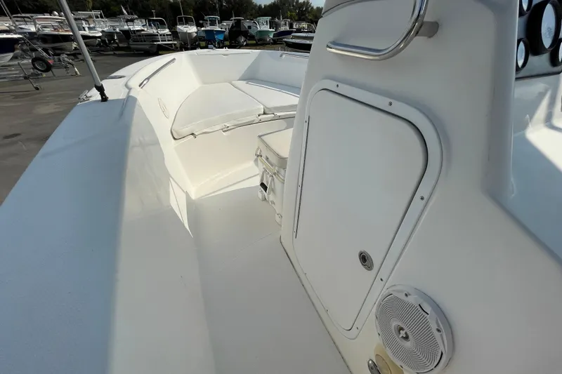 Slide: The Image of 2004 Fishmaster Travis Edition 220 boat interior with seating and storage compartments. - 29