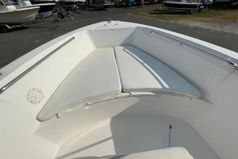 Slide: The Image of 2004 Fishmaster Travis Edition 220 boat interior with cushioned seating. - 35