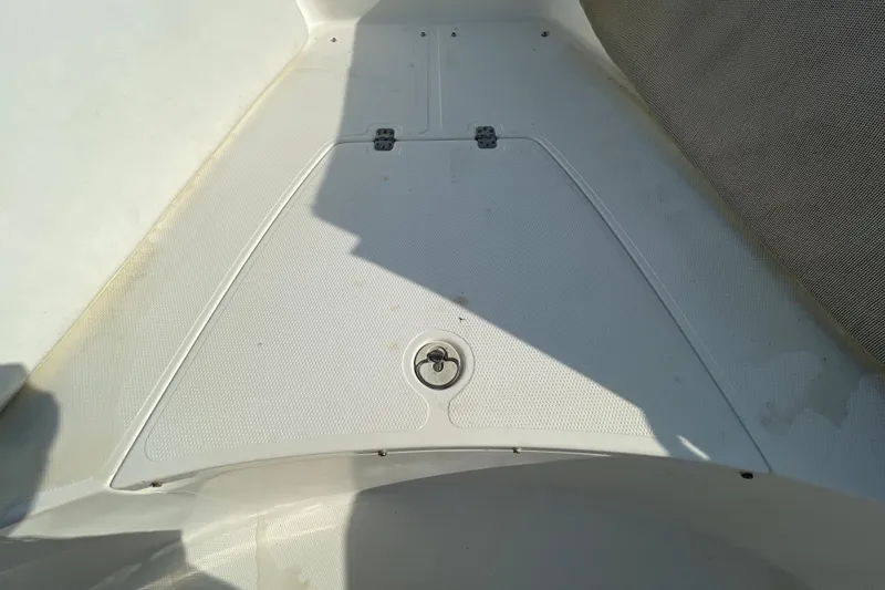 Slide: The Image of 2004 Fishmaster Travis Edition 220 boat deck with storage compartment. - 37