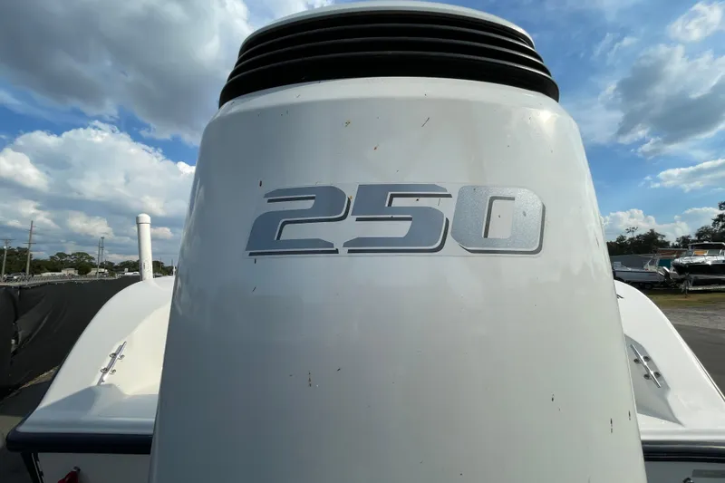 Slide: The Image of Outboard motor with "250" label on a 2004 Fishmaster Travis Edition 220 boat. - 7