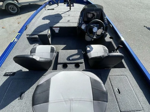 Slide: The Image of 2023 Crestliner XFC 179 boat interior with seating and steering console. - 5