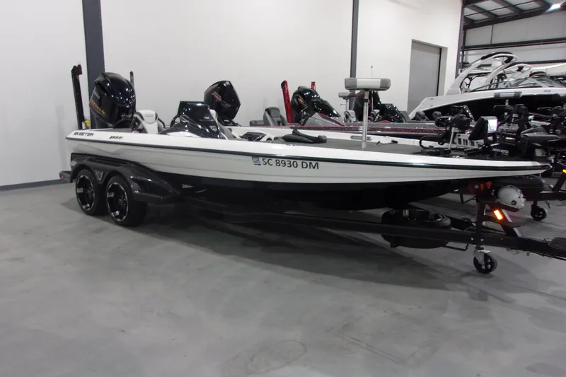 The Image of 2020 Skeeter FXR21 Limited boat in showroom, side view, on trailer. - 1