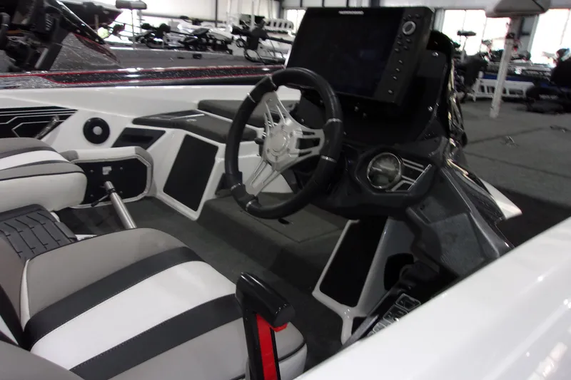 Slide: The Image of 2020 Skeeter FXR21 Limited boat interior with steering wheel and control panel. - 2